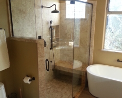 Remodeled bathroom with glass encased shower